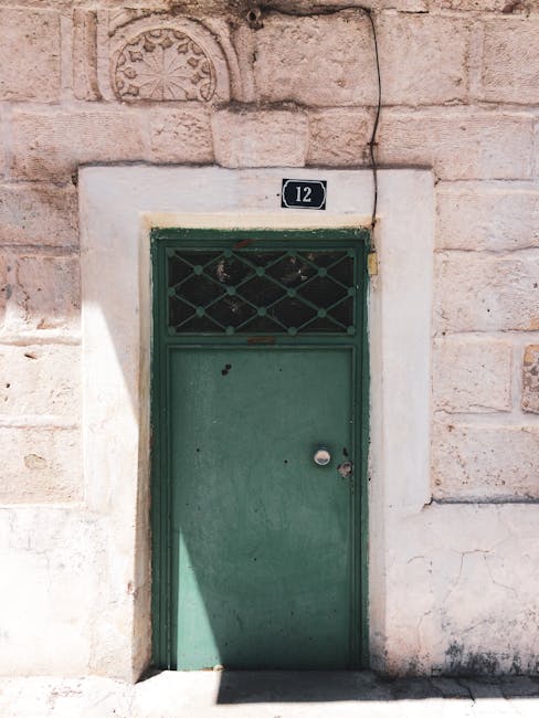 Green metal door with number 12