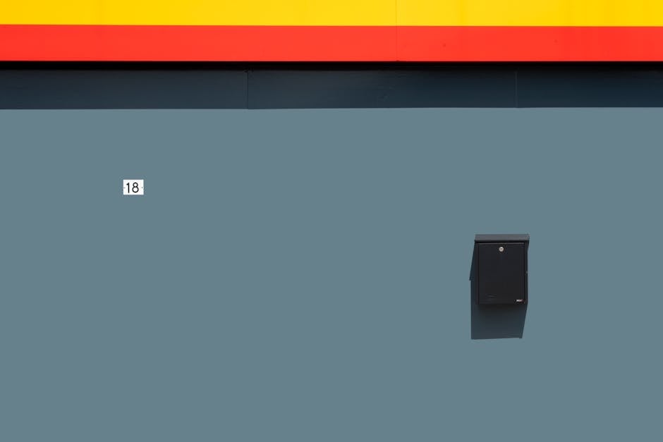 Blue wall with number 18 and a mailbox